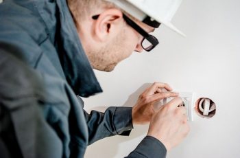 Electrician working on socket